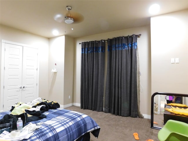 carpeted bedroom with a closet, baseboards, ceiling fan, and recessed lighting