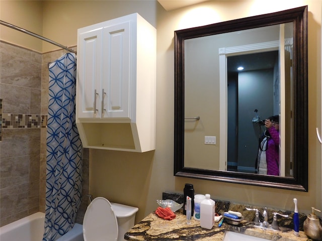 full bathroom featuring sink, toilet, and shower / bath combination with curtain