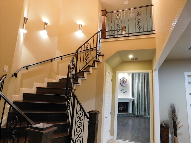 stairs featuring wood-type flooring