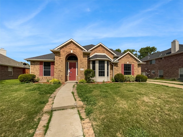 ranch-style house featuring a front yard