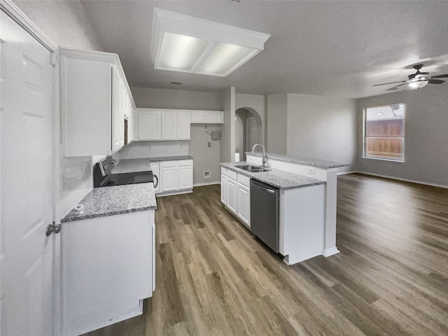 kitchen with a kitchen island with sink, dishwasher, white cabinets, and range