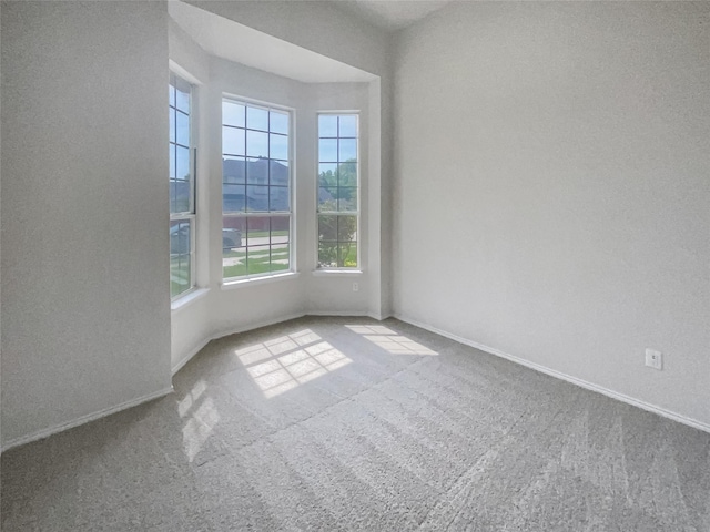 empty room with light colored carpet