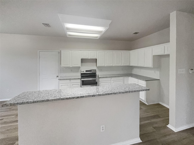 kitchen featuring light stone counters, dark wood-type flooring, white cabinets, a kitchen island, and stainless steel electric range