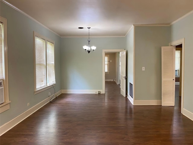 unfurnished room featuring dark wood-type flooring, crown molding, a chandelier, and plenty of natural light