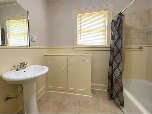 bathroom with ornamental molding, tile patterned flooring, and shower / bathtub combination with curtain