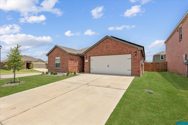 ranch-style house featuring a garage and a front lawn