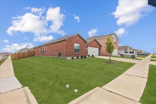 view of side of home with a garage and a lawn