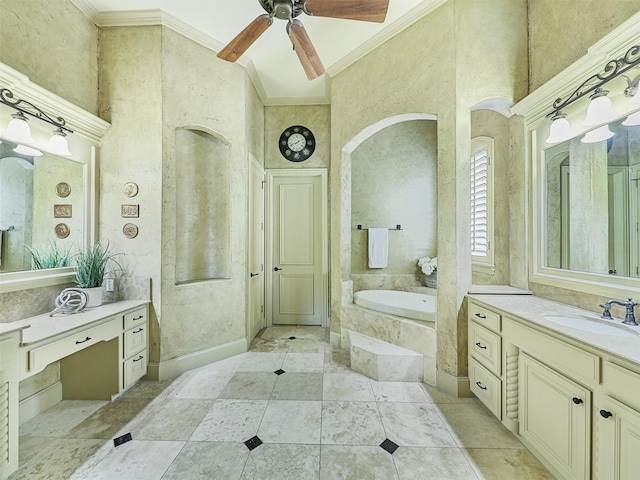 bathroom with ceiling fan, a high ceiling, vanity, ornamental molding, and tiled bath