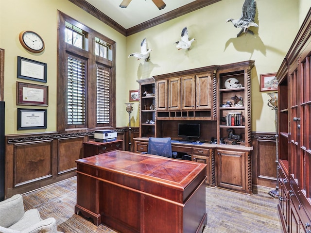 office area featuring crown molding, ceiling fan, and light wood-type flooring