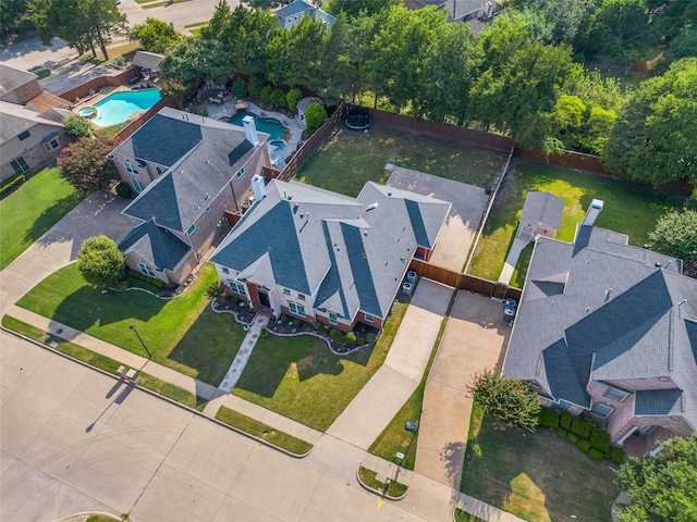 birds eye view of property with a residential view