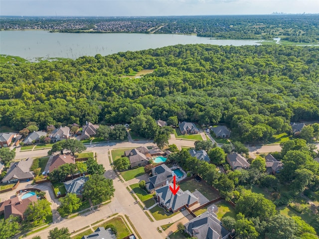 birds eye view of property with a water view and a residential view