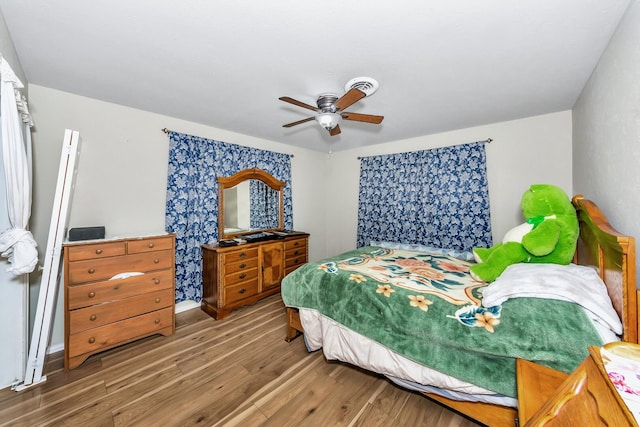 bedroom featuring wood-type flooring and ceiling fan