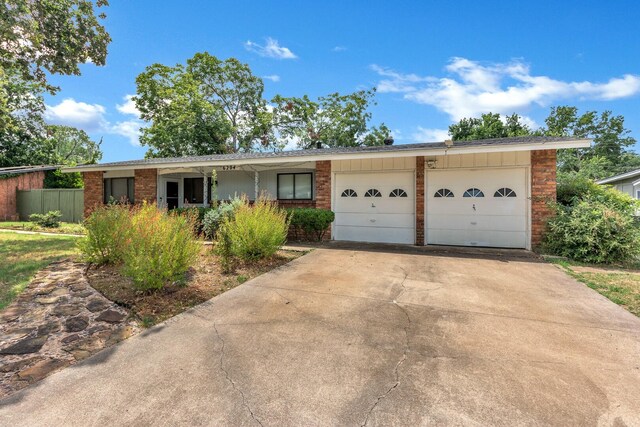 single story home with a garage