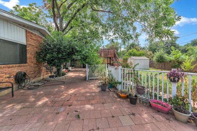 view of patio / terrace with a storage unit