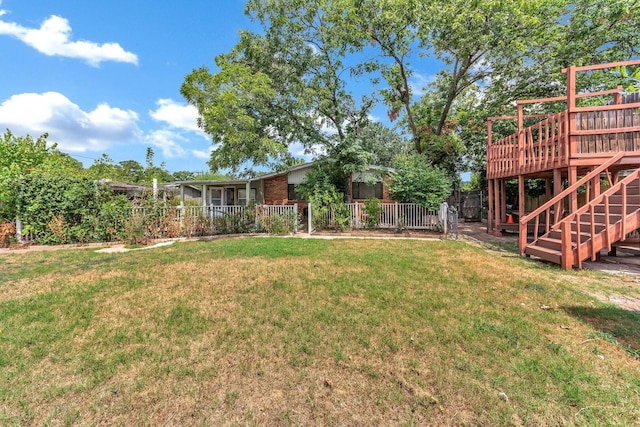 view of yard with a deck