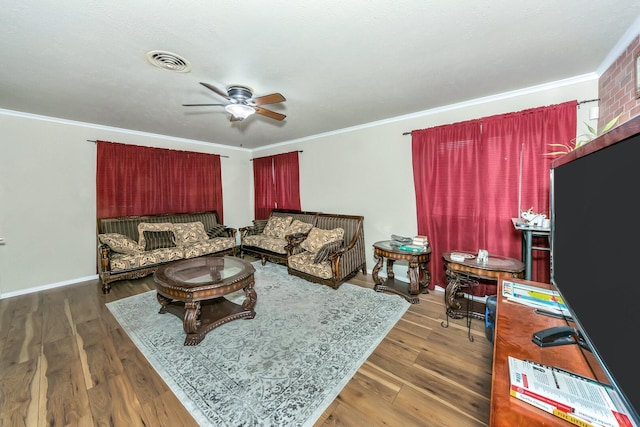 living room featuring ornamental molding, dark hardwood / wood-style floors, and ceiling fan