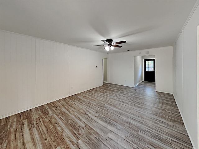 unfurnished room featuring ceiling fan and light wood-type flooring