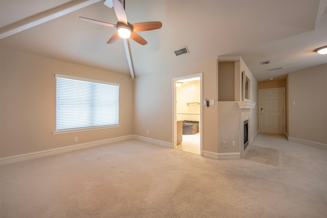 unfurnished living room featuring light colored carpet, ceiling fan, and vaulted ceiling with beams