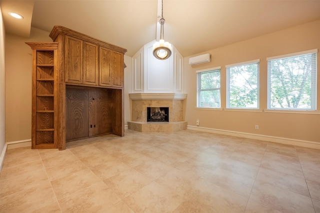 unfurnished living room featuring vaulted ceiling, a high end fireplace, and a wall unit AC