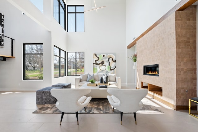 tiled living room featuring a high ceiling