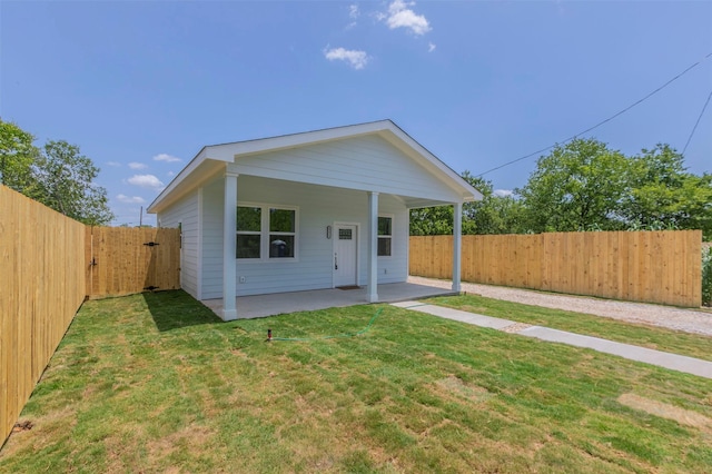 view of front of property with a front lawn and a patio