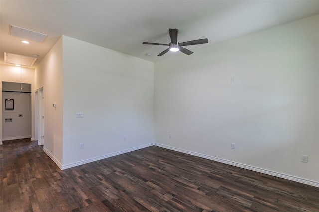 spare room with ceiling fan and dark hardwood / wood-style flooring