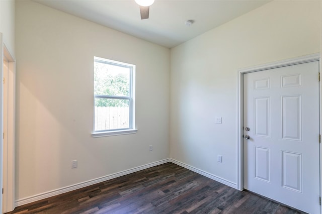 unfurnished room with ceiling fan and dark hardwood / wood-style flooring