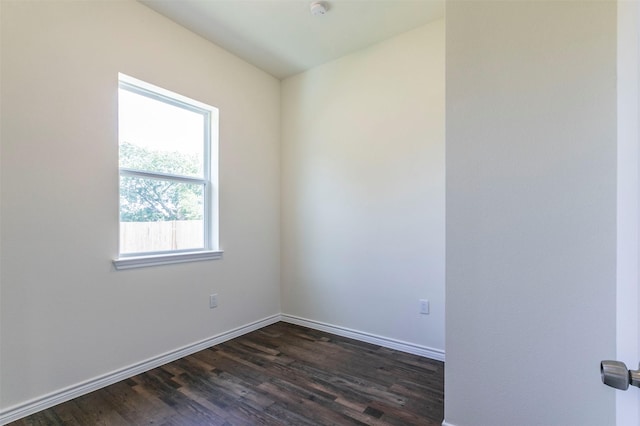 unfurnished room featuring dark hardwood / wood-style flooring