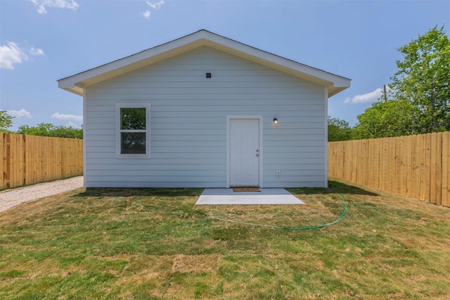 rear view of property with a yard