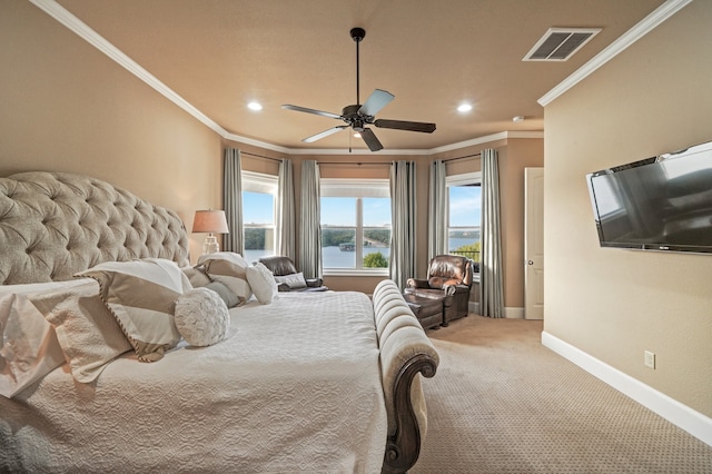 carpeted bedroom featuring ornamental molding and ceiling fan