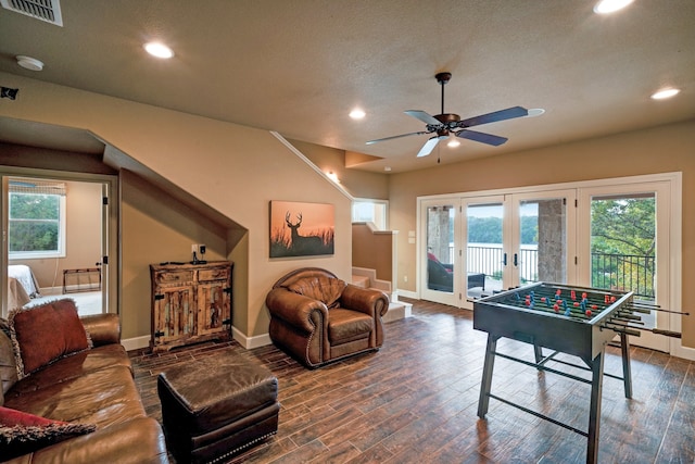 playroom with french doors, ceiling fan, plenty of natural light, and dark hardwood / wood-style flooring