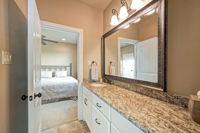 bathroom featuring ceiling fan and vanity