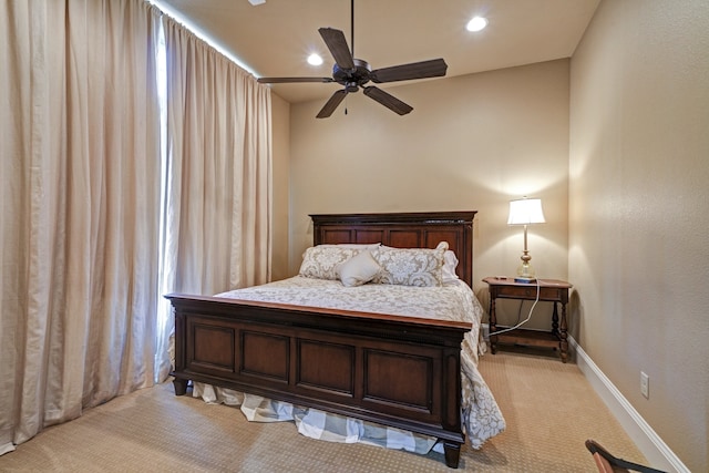 bedroom featuring light carpet and ceiling fan