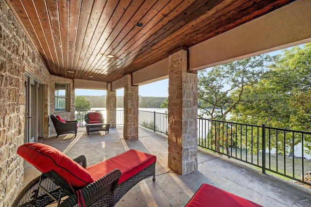 view of patio / terrace with a water view and an outdoor hangout area