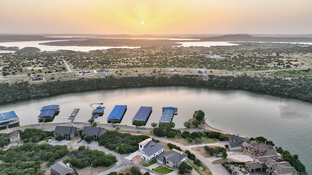 aerial view at dusk with a water view