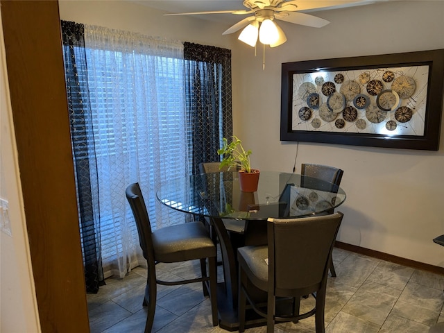 dining space with ceiling fan