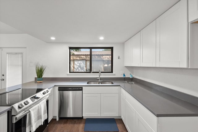 kitchen featuring dark wood-type flooring, sink, white cabinetry, and stainless steel appliances