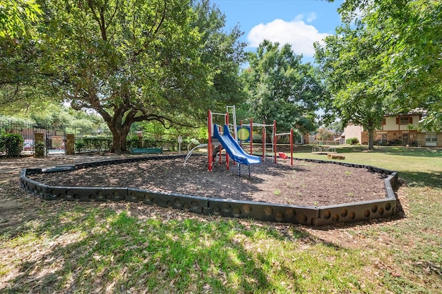 view of playground with a lawn