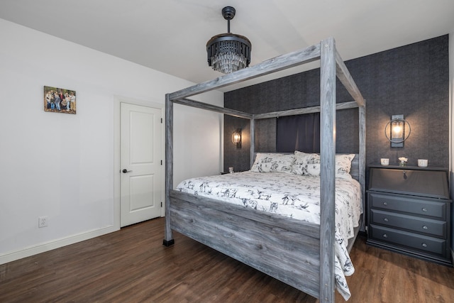 1195 Buck Creek Rd, Tioga, TX 76271 - bedroom with wood finished floors, baseboards, and a notable chandelier