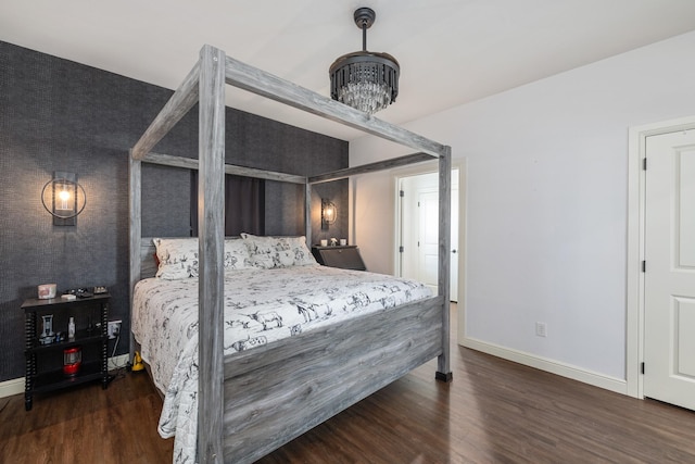 1195 Buck Creek Rd, Tioga, TX 76271 - bedroom featuring baseboards, wood finished floors, and a chandelier