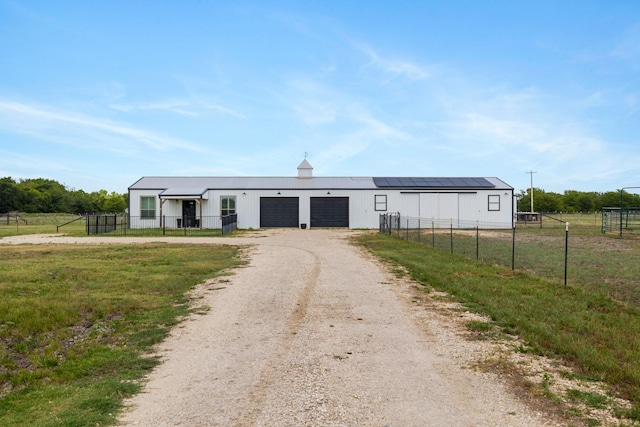1195 Buck Creek Rd, Tioga, TX 76271 - view of front of house featuring dirt driveway, an attached garage, an outbuilding, and fence