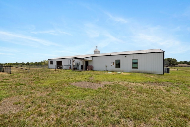 1195 Buck Creek Rd, Tioga, TX 76271 - rear view of property featuring fence, a lawn, and an outbuilding