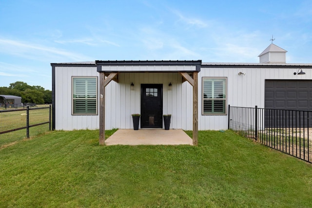 1195 Buck Creek Rd, Tioga, TX 76271 - rear view of house featuring a lawn, board and batten siding, an attached garage, fence, and metal roof