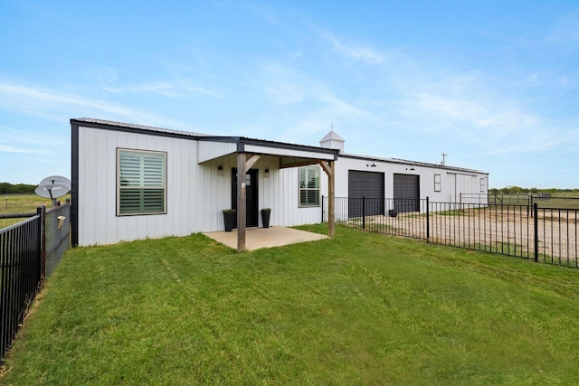 1195 Buck Creek Rd, Tioga, TX 76271 - back of house with a fenced backyard, driveway, a patio, a lawn, and a garage