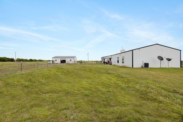 1195 Buck Creek Rd, Tioga, TX 76271 - view of yard featuring an outdoor structure, an outbuilding, central AC unit, and fence