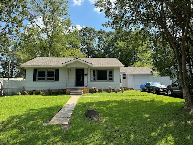 single story home featuring a garage and a front yard