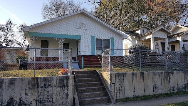 bungalow-style home with a porch