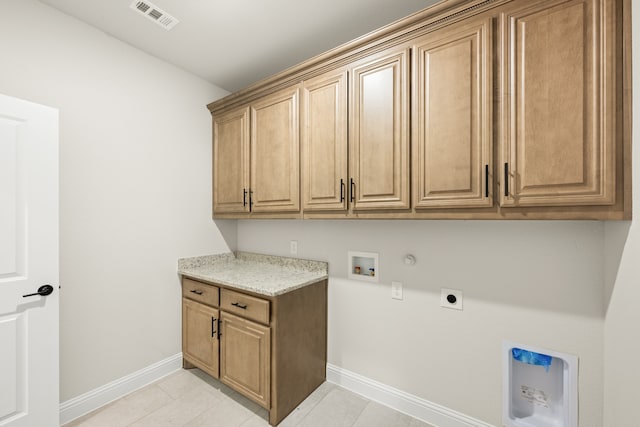 laundry area with cabinets, hookup for a washing machine, hookup for an electric dryer, gas dryer hookup, and light tile patterned floors