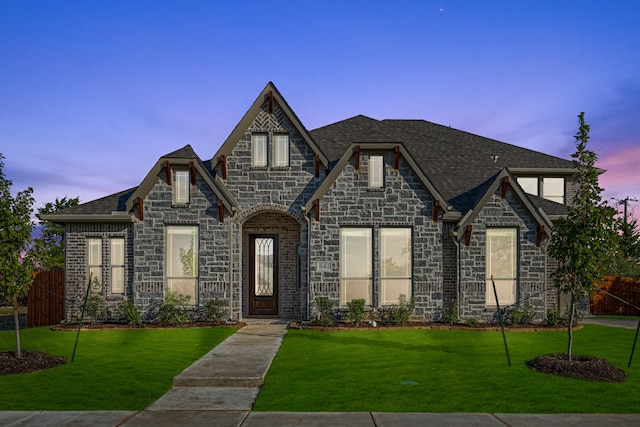 view of front of home with a yard