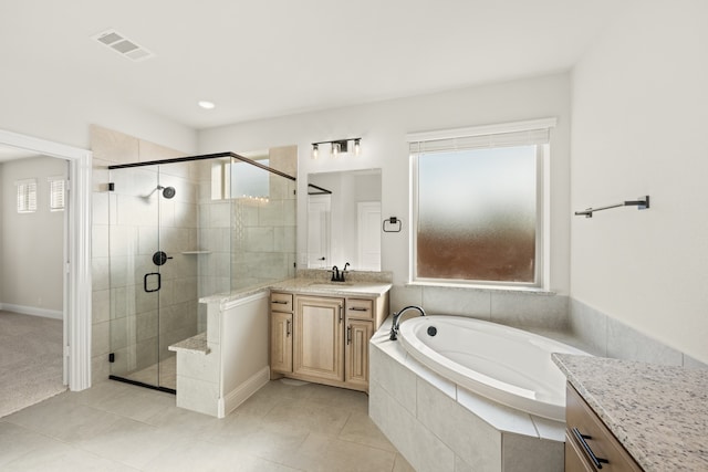 bathroom featuring separate shower and tub, tile patterned flooring, and vanity